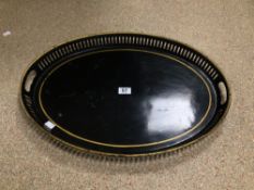 VICTORIAN BLACK JAPANNED AND GILT DECORATED OVAL GALLERIED TEA TRAY. 61CM LONG.