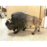 A MELBA WARE PORCELAIN MODEL OF A BISON 20 CMS HIGH 24 CMS LONG