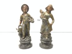 A PAIR OF SPELTER FIGURES OF DUTCH HARVEST WORKERS, 20CMS