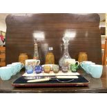 3 COLOURED GLASS SHADES WITH 2 DECANTERS AND A SET OF 6 TEA CUPS AND SAUCERS AND MORE