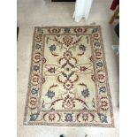 AN INDIAN BEIGE GROUND PATTERN RUG 150 X 190CMS