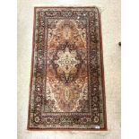 A HERIZ RUG RED GROUND AND WOLLEN 80 X 160 CMS