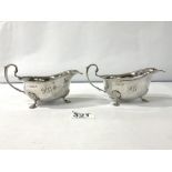 A PAIR OF HEAVY HALLMARKED SILVER SAUCEBOATS WITH BEADED BORDERS ON HOOF FEET BIRMINGHAM 1909, 310