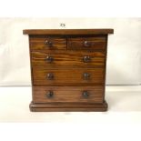 A VICTORIAN MINIATURE INLAID MAHOGANY AND FAUX ROSEWOOD ROUND CORNER CHEST OF DRAWERS, 27 X 28CM