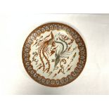 A 19TH CENTURY JAPANESE KUTANI PORCELAIN WALL PLATE, DECORATED WITH STYLISED BIRDS, 33CMS