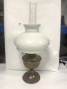 A BRASS OIL LAMP WITH GLASS SHADE, 60CMS