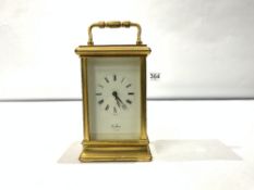 A BRASS CARRIAGE CLOCK WITH KEY MADE BY ST JAMES LONDON