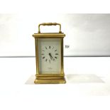 A BRASS CARRIAGE CLOCK WITH KEY MADE BY ST JAMES LONDON