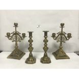 A PAIR OF ECCLESIASTICAL BRASS CANDLESTICKS, 24CMS