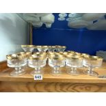 TWO SETS OF GOLD BORDERED AND ETCHED GLASS CHAMPAGNE GLASSES AND SUNDAE GLASSES AND BOWL