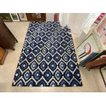 A BLUE GEOMETRIC DESIGN CARPET 180 X 270CMS