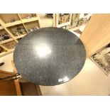 A LARGE CIRCULAR MARBLE TOP BAR TABLE ON LARGE EBONISED FLUTED BASE, 120CMS DIAMETER 106CMS HIGH