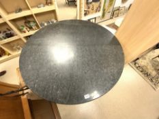 A LARGE CIRCULAR MARBLE TOP BAR TABLE ON LARGE EBONISED FLUTED BASE, 120CMS DIAMETER 106CMS HIGH