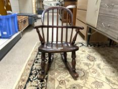 A 19TH CENTURY CHILDS ELM STICK BACK HOOP BACK ROCKING CHAIR