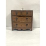 A MINIATURE BURR WALNUT BOW FRONTED CHEST OF FOUR DRAWERS, 19 X 20CMS