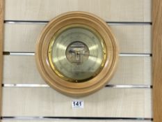 A RUSSELL OF NORWICH TWIN DIAPHRAGM CIRCULAR WALL BAROMETER, 24CMS DIAMETER