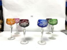 A SET OF SIX COLOURED CUT GLASS HOCK GLASSES