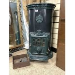 A TALL ENAMELLED ORNATE IRON CATHEDRAL STOVE -GODIN 88 CMS