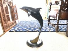 A PATINATED BRASS SCULPTOR OF A DOLPHIN ON MARBLE BASE, 52CMS