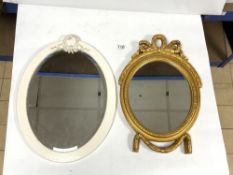 A SMALL OVAL WALL MIRROR AND PAINTED OVAL MIRROR, 44 X 30CMS