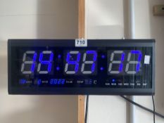 A DIGITAL YEAR MONTH DAY DATE AND TEMP WALL MOUNTED CLOCK