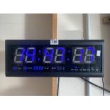 A DIGITAL YEAR MONTH DAY DATE AND TEMP WALL MOUNTED CLOCK