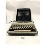 A VINTAGE REMINGTON ENVOY PORTABLE TYPEWRITER