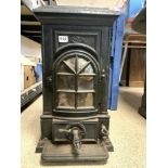 AN IRON WOODBURNING STOVE INSCRIBED NO1 BUNTESSE 34 X 62 CMS