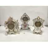 A PORCELAIN FLORAL ENCRUSTED CLOCK, 22CMS, AND TWO FLORAL DECORATED PORCELAIN CLOCKS