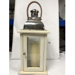 A WOODEN FRAMED AND CHROME STORM LANTERN