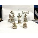 THREE PORCELAIN FIGURAL FLORAL ENCRUSTED CANDLESTICKS, 30CMS WITH A PAIR CHERUB PORCELAIN POSY VASES