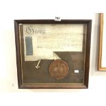 A GEORGE 111 DOCUMENT AND WAX SEAL IN A GLAZED OAK FRAME 42 X 42 CMS