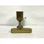 AN 18TH CENTURY OVAL ENGRAVED BRASS TOBACCO BOX, 18CMS AND A 19TH CENTURY EMBOSSED BRASS GOBLET