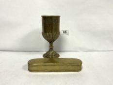AN 18TH CENTURY OVAL ENGRAVED BRASS TOBACCO BOX, 18CMS AND A 19TH CENTURY EMBOSSED BRASS GOBLET