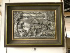 A FRAMED EMBOSSED METAL PICTURE OF AN ORIENTAL DWELLING
