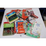 A QUANTITY OF FOOTBALL PROGRAMMES MAINLY FROM THE 1960'S/70'S MOSTLY CLUB GAMES, SOME