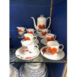 A WEDGWOOD SUSIE COOPER DESIGN-COM POPPY PATTERN FIFTEEN PIECE COFFEE SET