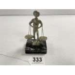 A SILVER-PLATED FIGURE OF A FISHERMAN WITH CATCH ON A MARBLE BASE, 12CMS