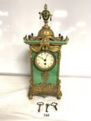 A FRENCH LATE 19TH CENTURY ORMOLU AND GREEN GLASS EMPIRE DESIGN MANTEL CLOCK WITH LION'S HEAD AND