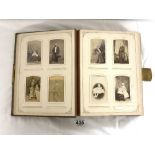 A VICTORIAN CARTE DE VISITE PHOTOGRAPH ALBUM CONTAINING FAMILY PORTRAITS