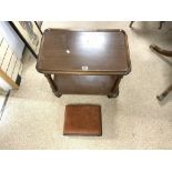 A MAHOGANY TWO TIER TROLLEY ON TURNED SUPPORTS AND A MAHOGANY FOOTSTOOL ON BUN FEET