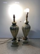 A PAIR OF GOLD AND SILVERED FLUTED URN SHAPED TABLE LAMPS, 58CMS