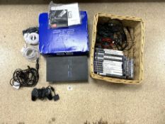 A BOXED PLAYSTATION 2 AND 16 GAMES WITH ACCESSORIES