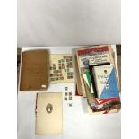 A FRENCH JOURNAL CONTAINING POSTCARDS, BOOKLETS ETC, OLD NEWSPAPERS, STAMPS, AND A CHRISTMAS 1949