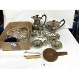 A PLATED THREE-PIECE TEA SET, SIX KNIVE RESTS OTHER PLATED WARES, AND GLASS