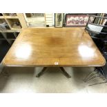 A REGENCY MAHOGANY CROSSBANDED SNAP TOP DINING TABLE ON FLUTED LEGS AND CLAW FEET AND BANDED