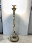 A MODERN BRASS LAMP STAND ON A CIRCULAR BASE, 100CMS