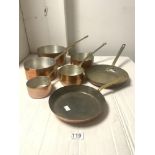 A SET OF FIVE GRADUATING COPPER SAUCEPANS AND TWO FRYING PANS