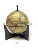 A SMALL SPANISH TERRESTRIAL GLOBE ON METAL STAND, 22CMS DIAMETER