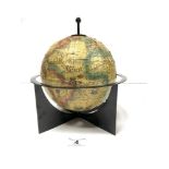 A SMALL SPANISH TERRESTRIAL GLOBE ON METAL STAND, 22CMS DIAMETER